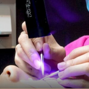 LASHTOUCH LED gel lamp curing lashes during professional lash extension service