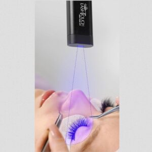 LED gel lamp curing lashes during professional lash extension application