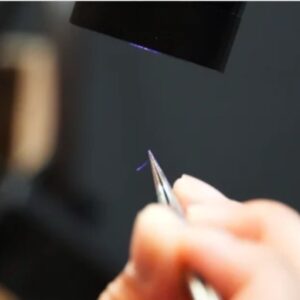 LED gel lamp curing tool during professional lash extension preparation